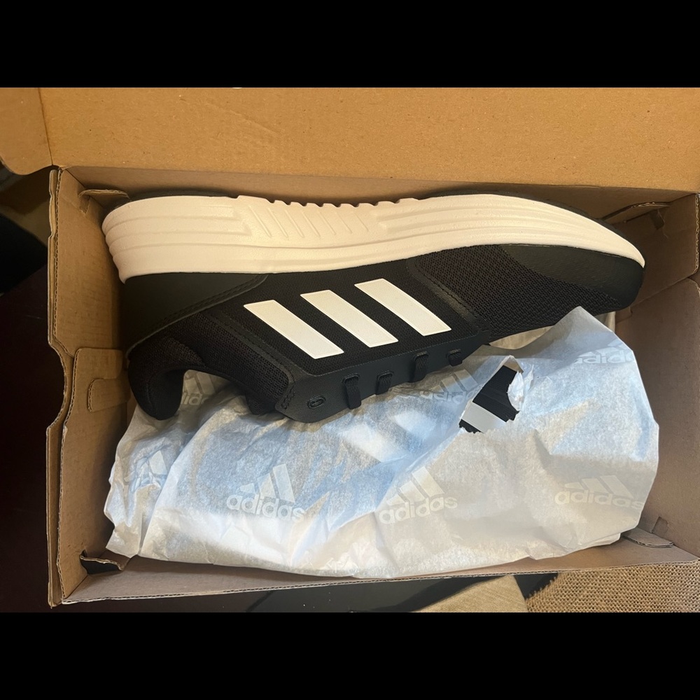 Men’s size 9 brand new Adidas Sneaker. Galaxy